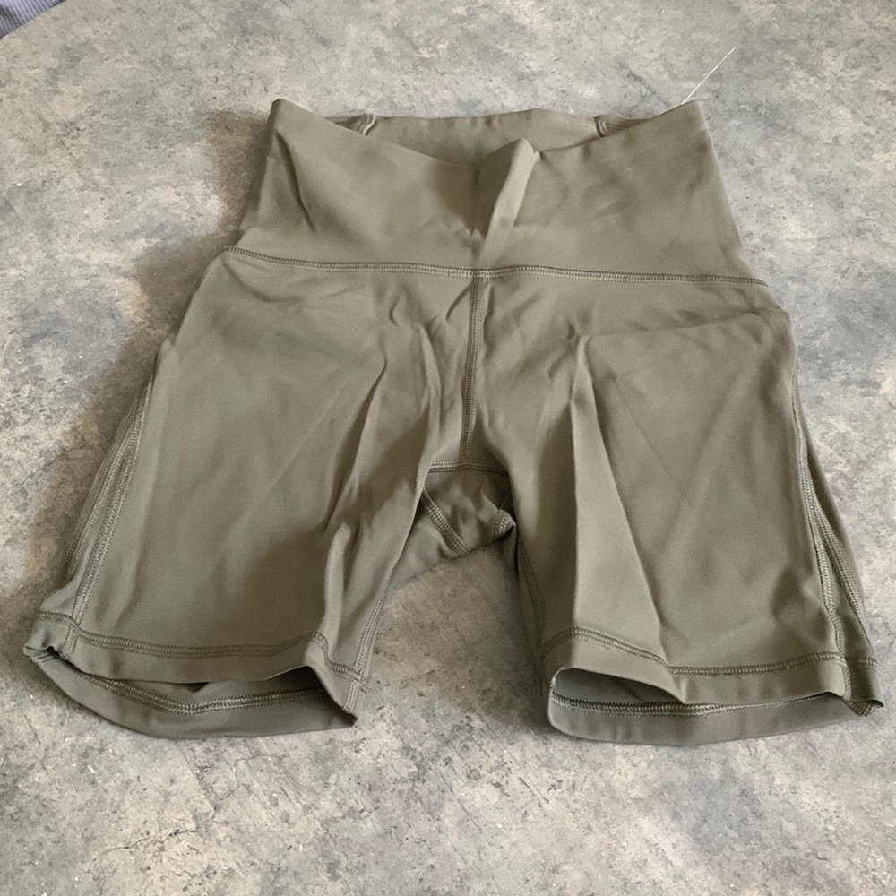 Neutral green Lululemon biker shorts